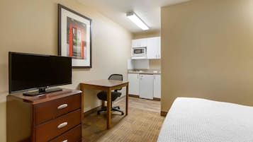 Desk, laptop workspace, blackout drapes, iron/ironing board