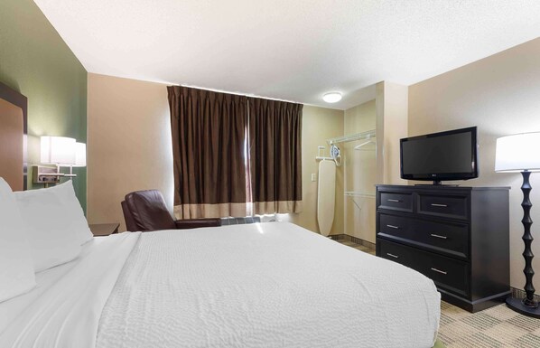 Desk, laptop workspace, blackout curtains, iron/ironing board