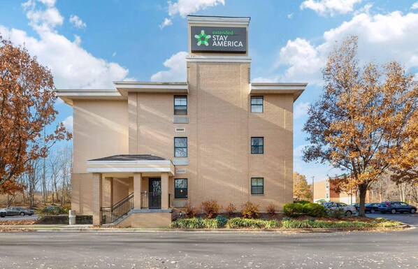 A two-story brick building with a sign for Extended Stay America.
