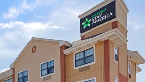 A hotel sign with the text "extended STAY AMERICA".