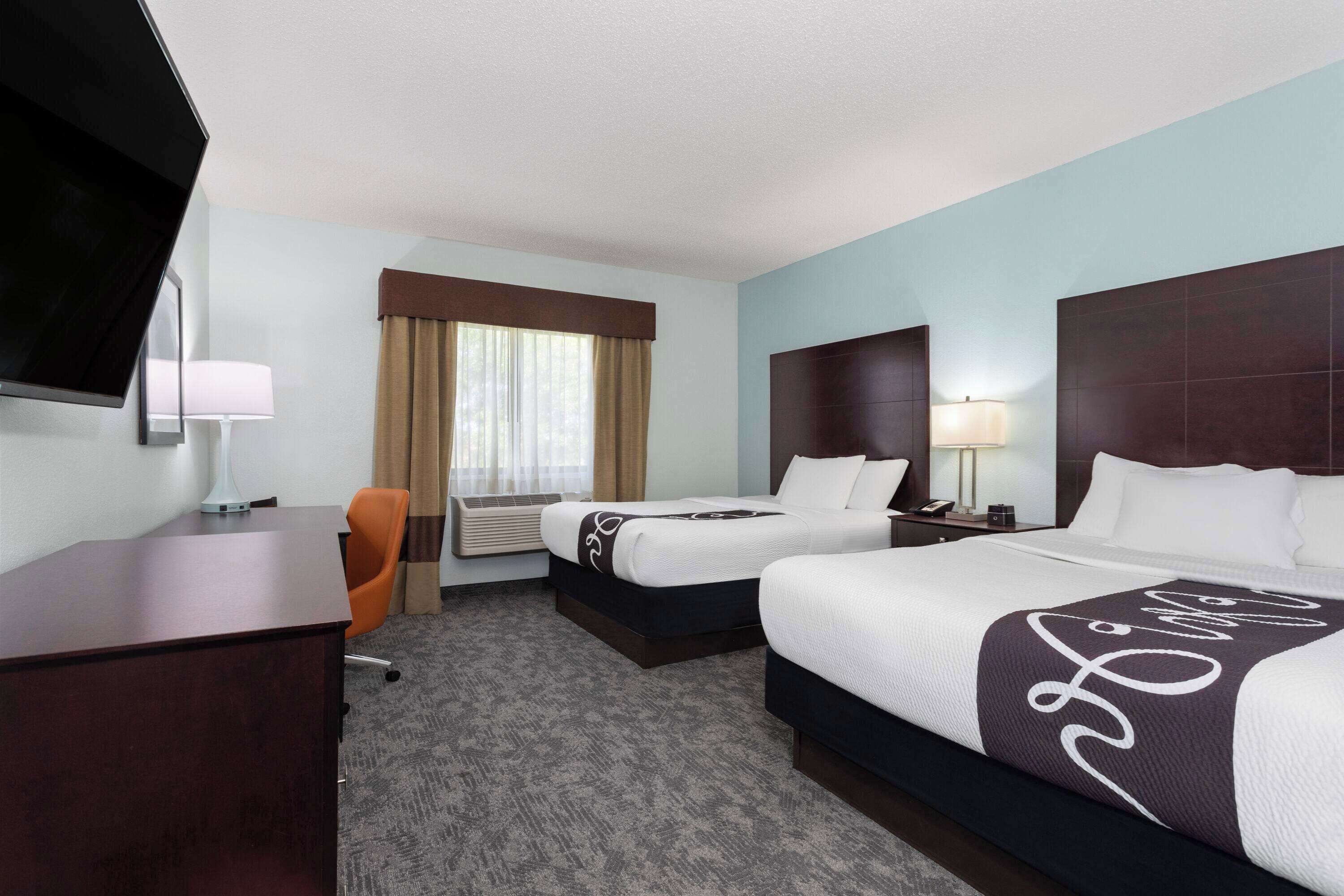 premium bedding, desk, blackout curtains, iron/ironing board