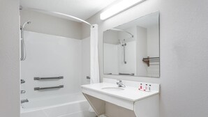A modern bathroom with a bathtub, shower, and sink. - Days Inn by Wyndham Lugoff (Lugoff)