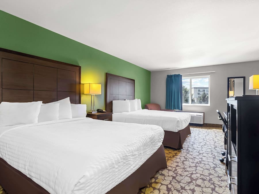 Desk, laptop workspace, blackout drapes, iron/ironing board