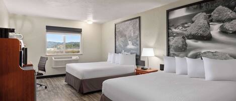 A hotel room with two beds, a desk, a chair, a window with a view, and a painting on the wall.