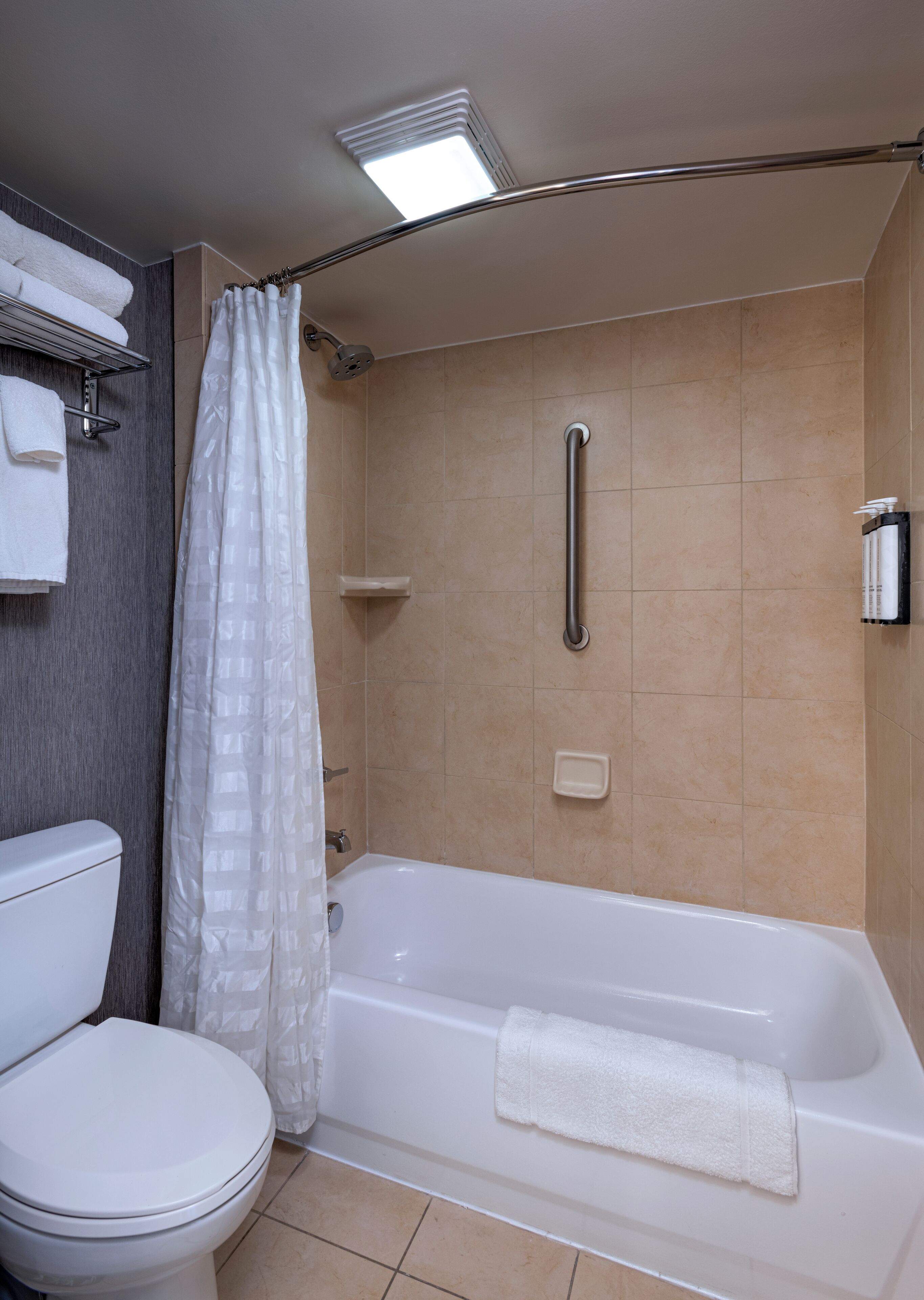 combined shower/bathtub, designer toiletries, hair dryer, towels