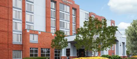 A brick building with a sign reading 'Candlewood Suites.'