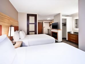 Premium bedding, pillow-top beds, laptop workspace, blackout curtains