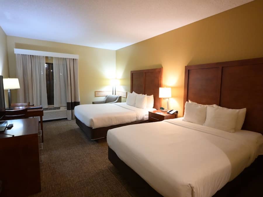 Premium bedding, laptop workspace, blackout curtains, iron/ironing board