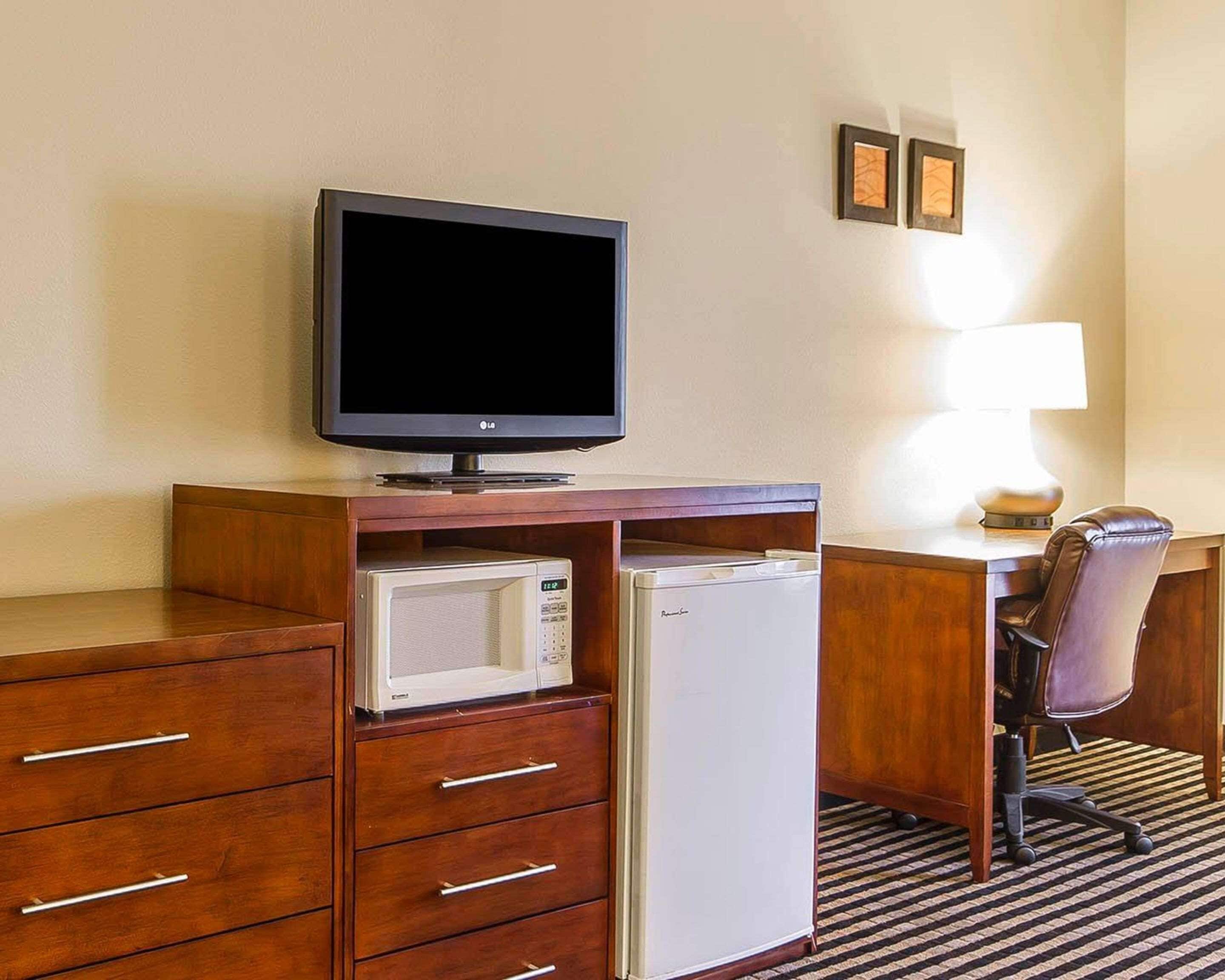 premium bedding, laptop workspace, blackout curtains, iron/ironing board