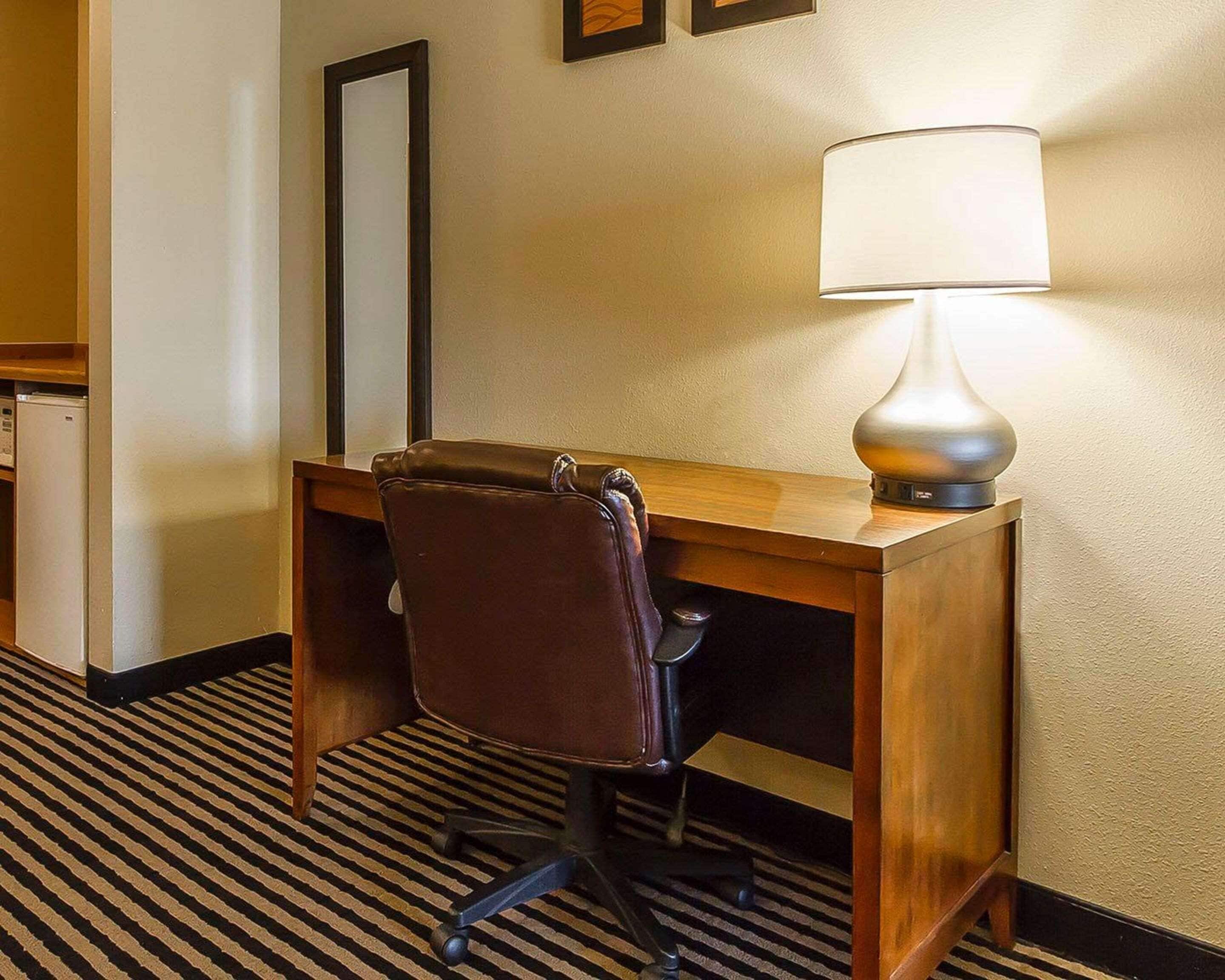 premium bedding, laptop workspace, blackout curtains, iron/ironing board