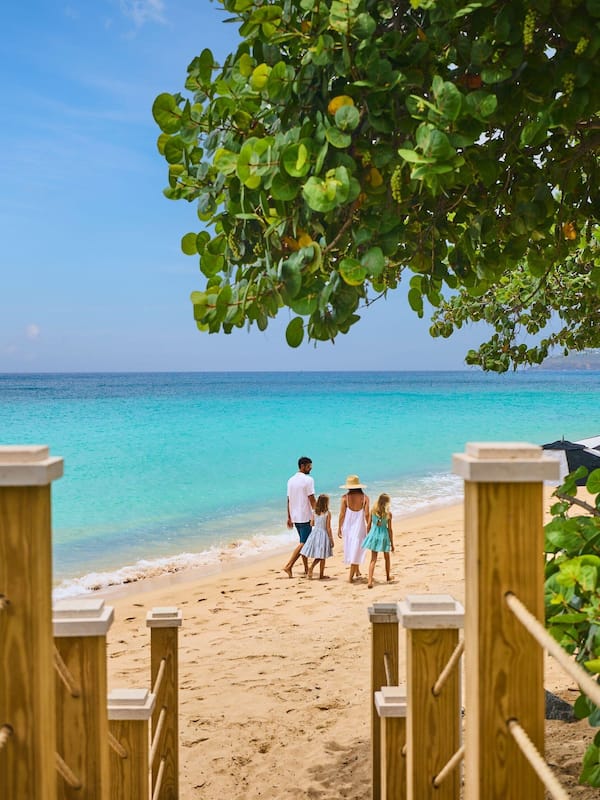 On the beach, white sand, beach cabanas, beach towels