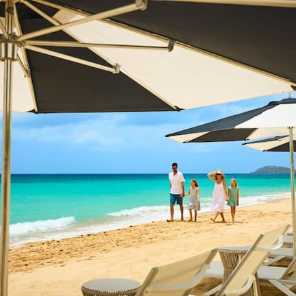 On the beach, white sand, beach cabanas, beach towels