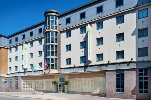 A multi-story Holiday Inn Express building with a central entrance, multiple windows, and a brick facade. - Holiday Inn Express London City by IHG (London)