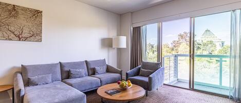 Executive One Bedroom Apartment | Living area | 32-inch LED TV with digital channels, TV