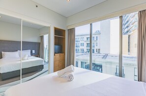One Bedroom Apartment | Minibar, in-room safe, desk, laptop workspace