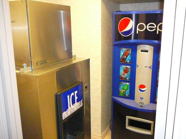 A vending machine with Pepsi products and an ice dispenser.