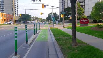 A street view with a bike lane, traffic lights, and a sign for King Residence Inn Marriott.