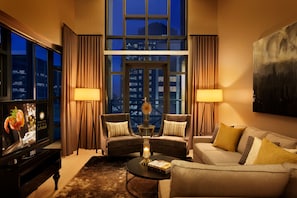 Senior Penthouse, Multiple Beds | Living area | 42-inch flat-screen TV with digital channels, TV, pay films
