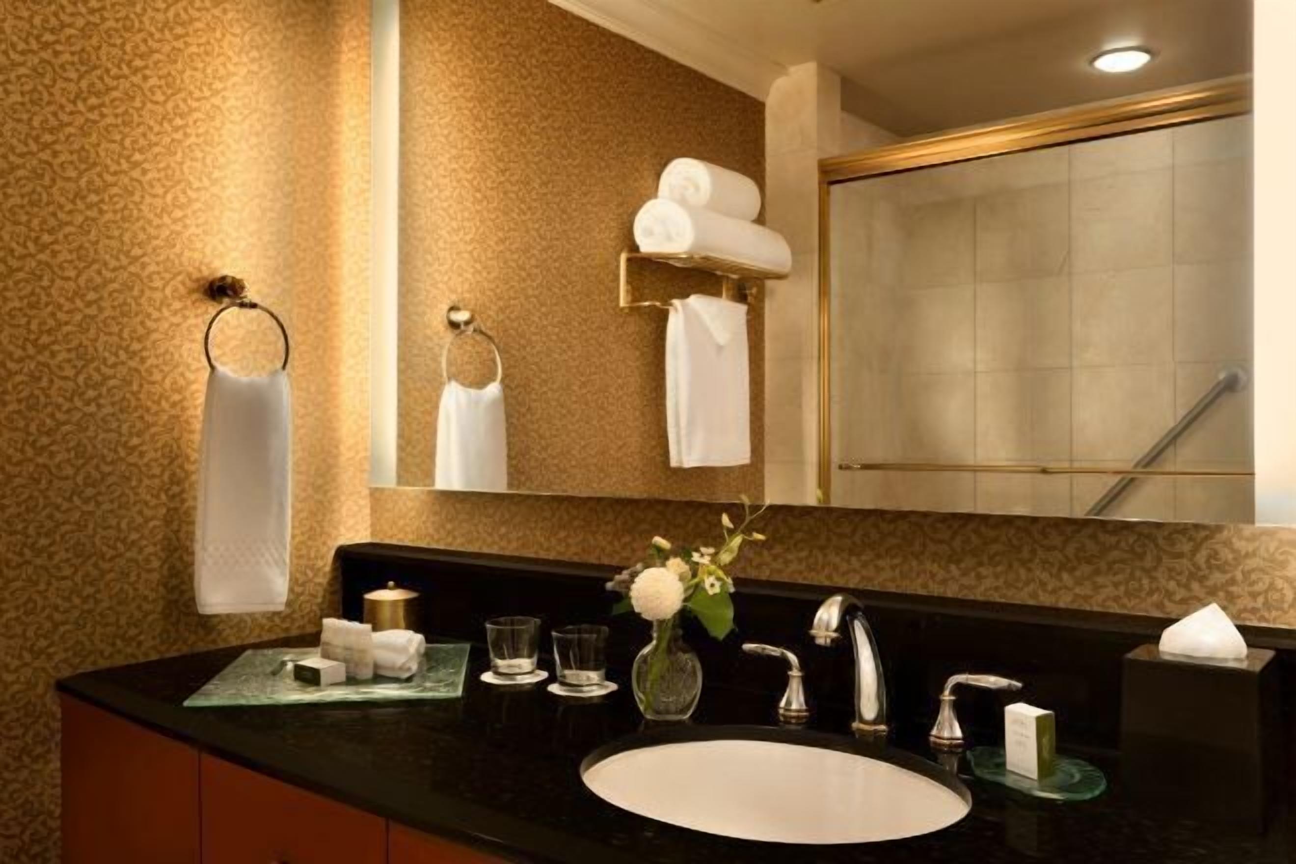 Designer toiletries, hair dryer, bathrobes, slippers