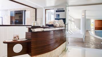 Indoor pool, seasonal outdoor pool, pool umbrellas, pool loungers