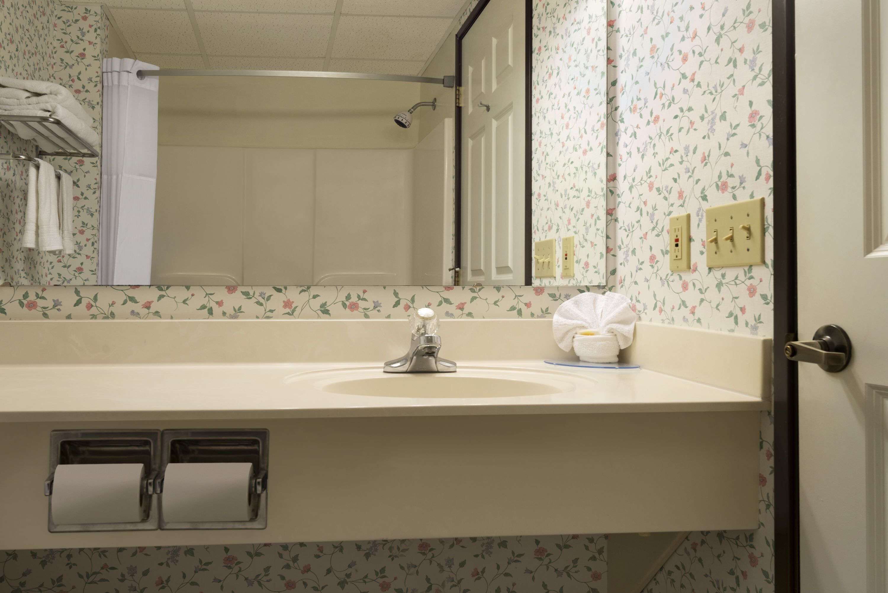 rainfall showerhead, hair dryer, towels, soap