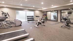 A gym with treadmills, stationary bikes, and weight machines. - La Quinta Inn & Suites by Wyndham Oklahoma City - NW Expwy (Oklahoma City)
