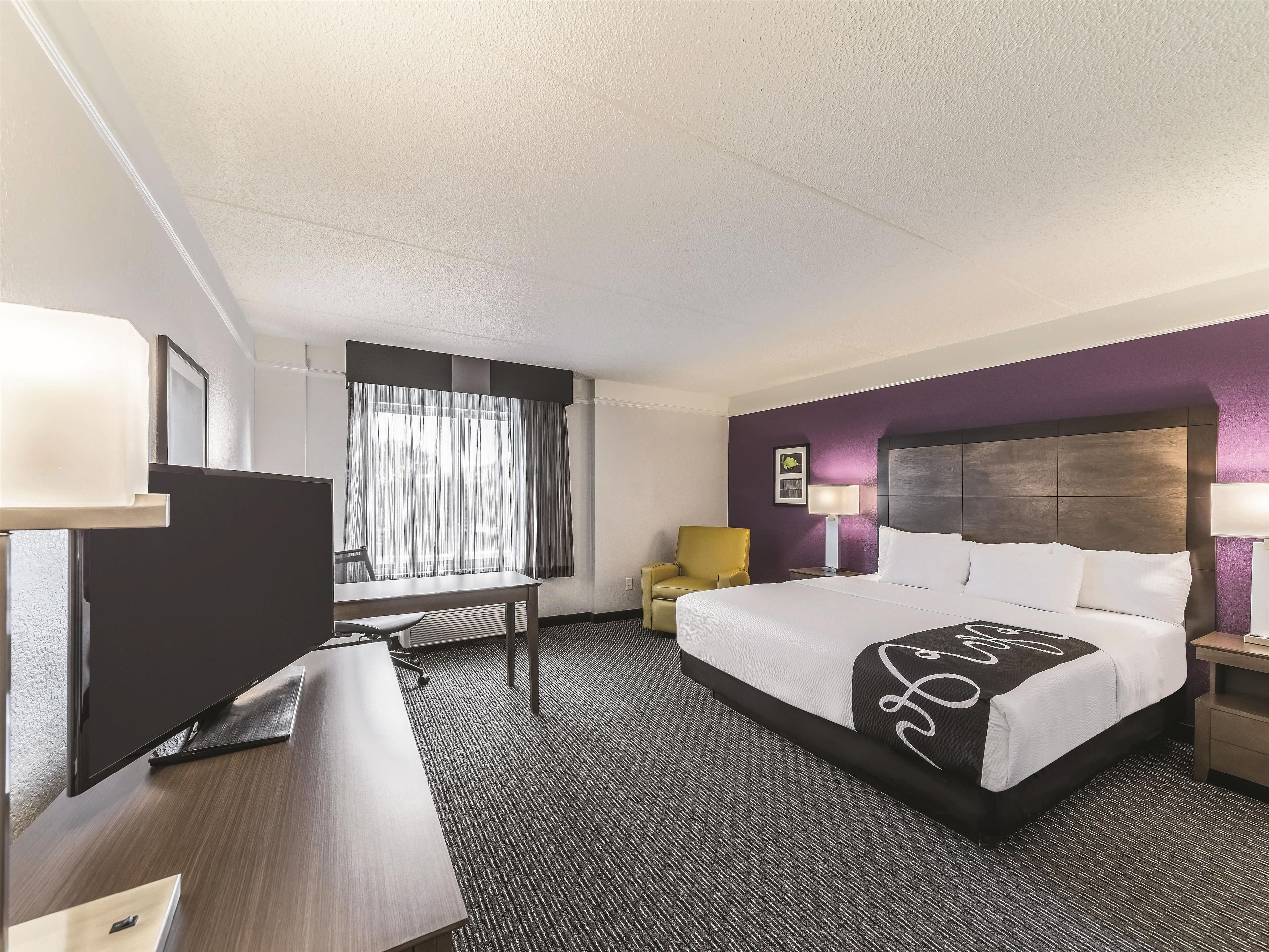 pillow-top beds, desk, laptop workspace, blackout curtains