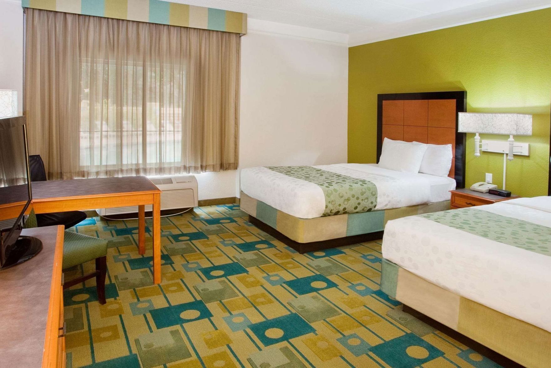 Premium bedding, pillowtop beds, desk, blackout drapes