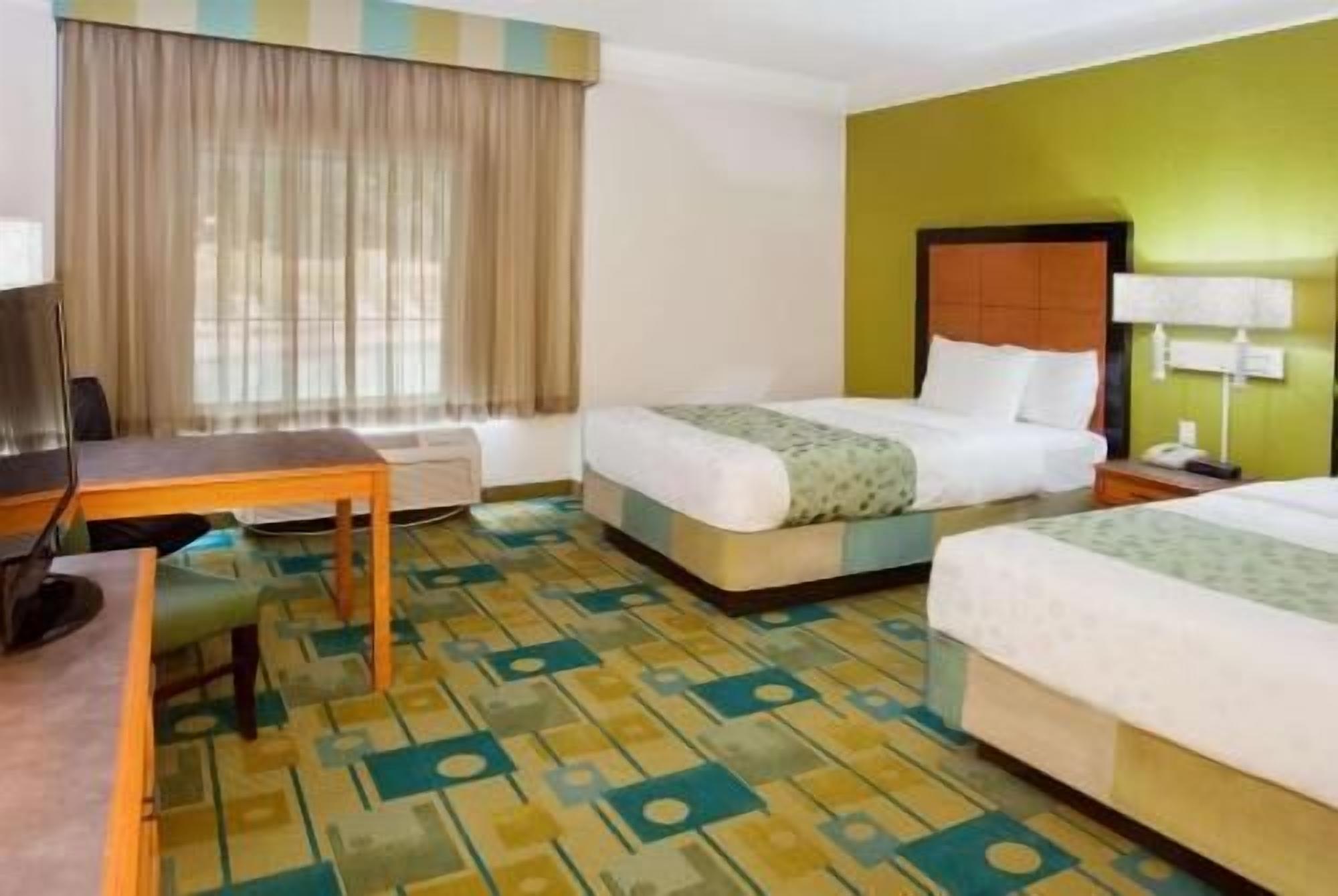 Premium bedding, pillowtop beds, desk, blackout drapes