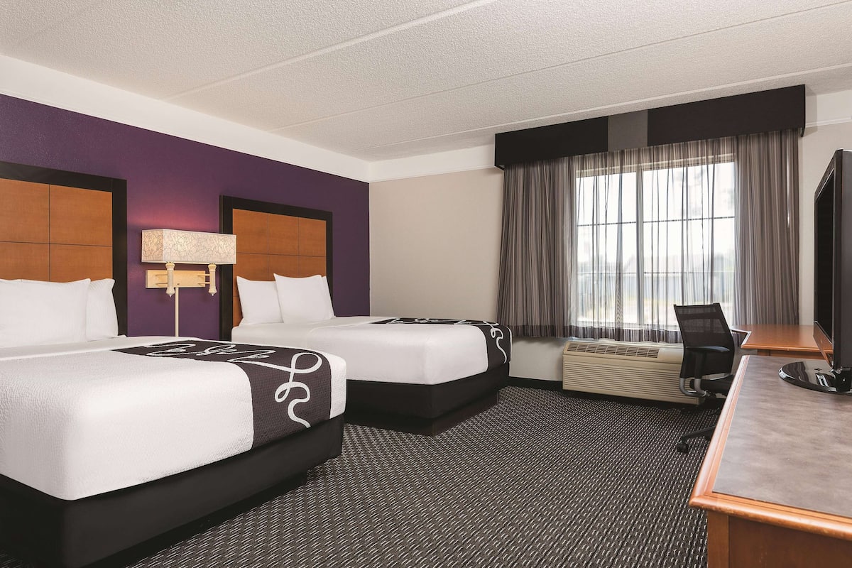 Premium bedding, desk, laptop workspace, iron/ironing board