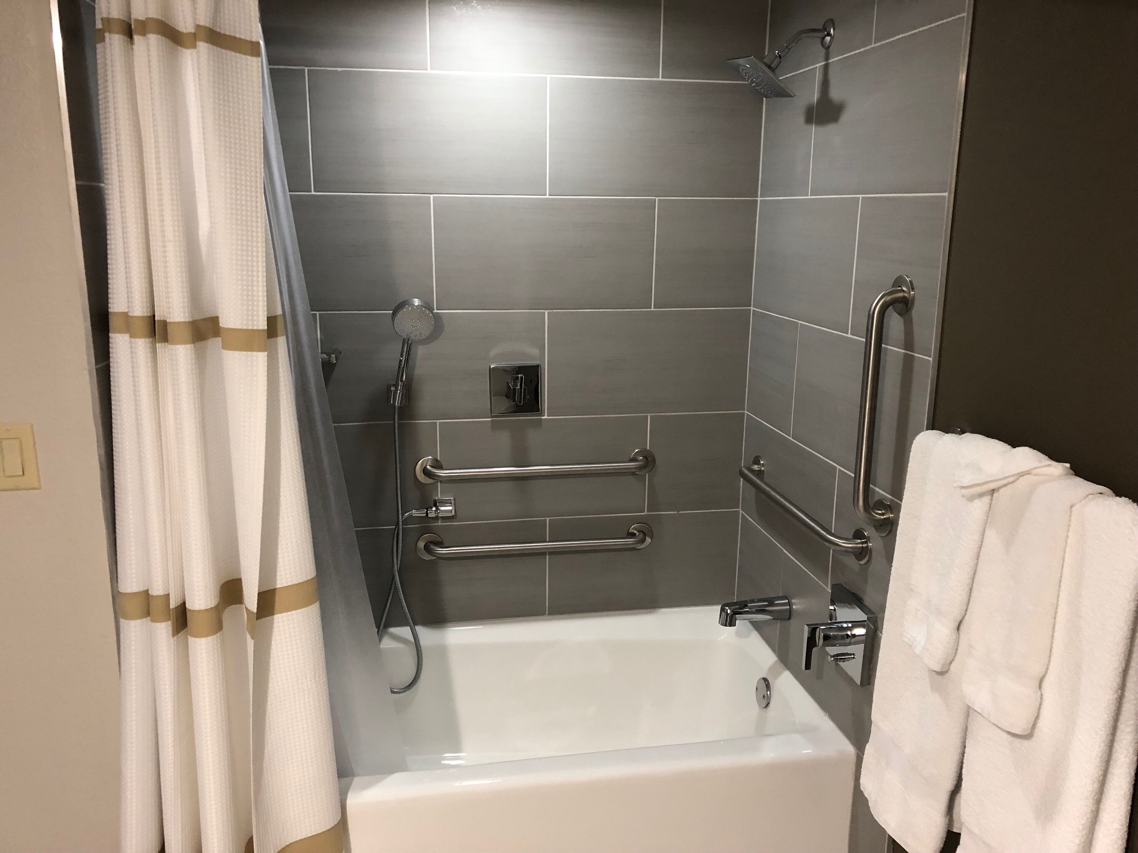 eco-friendly toiletries, hair dryer, slippers, towels