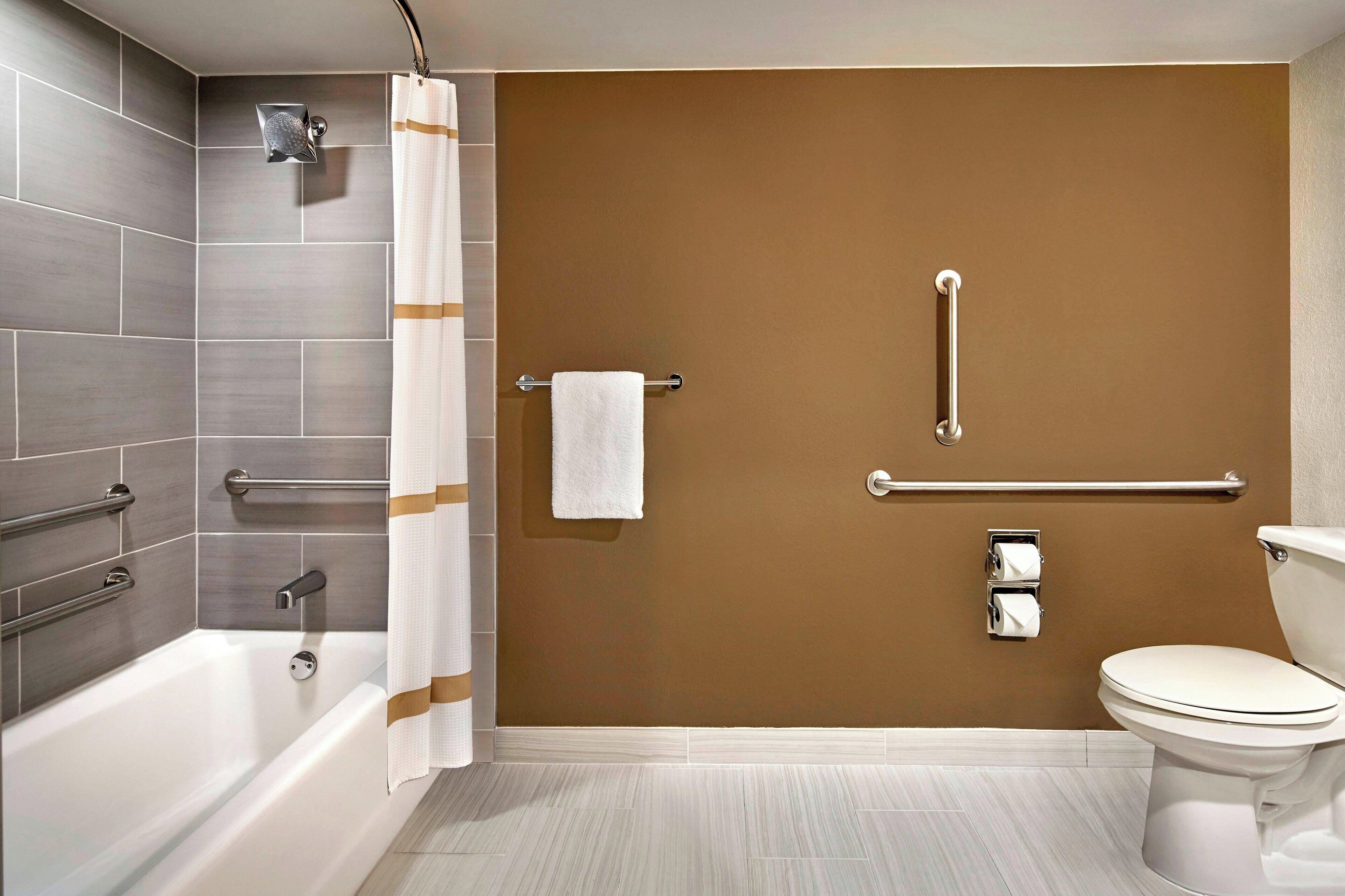 eco-friendly toiletries, hair dryer, slippers, towels