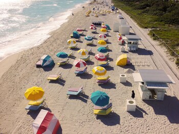 On the beach, sun loungers, beach umbrellas, beach towels at ANDAZ MIAMI BEACH, BY HYATT