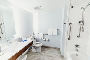 Room, 1 King Bed, Accessible (Comms Accessible. Roll-In Shower) | Bathroom | Hair dryer, towels