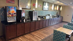 A juice bar with a refrigerated display and a sign for 'Hydrate Juice Bar'.