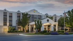 A modern hotel with a prominent entrance, large windows, and a well-maintained exterior. - Hyatt Place Boise/Towne Square (Boise)
