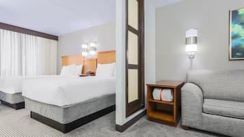 Premium bedding, desk, laptop workspace, blackout drapes