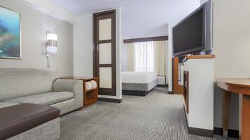Premium bedding, desk, laptop workspace, blackout drapes