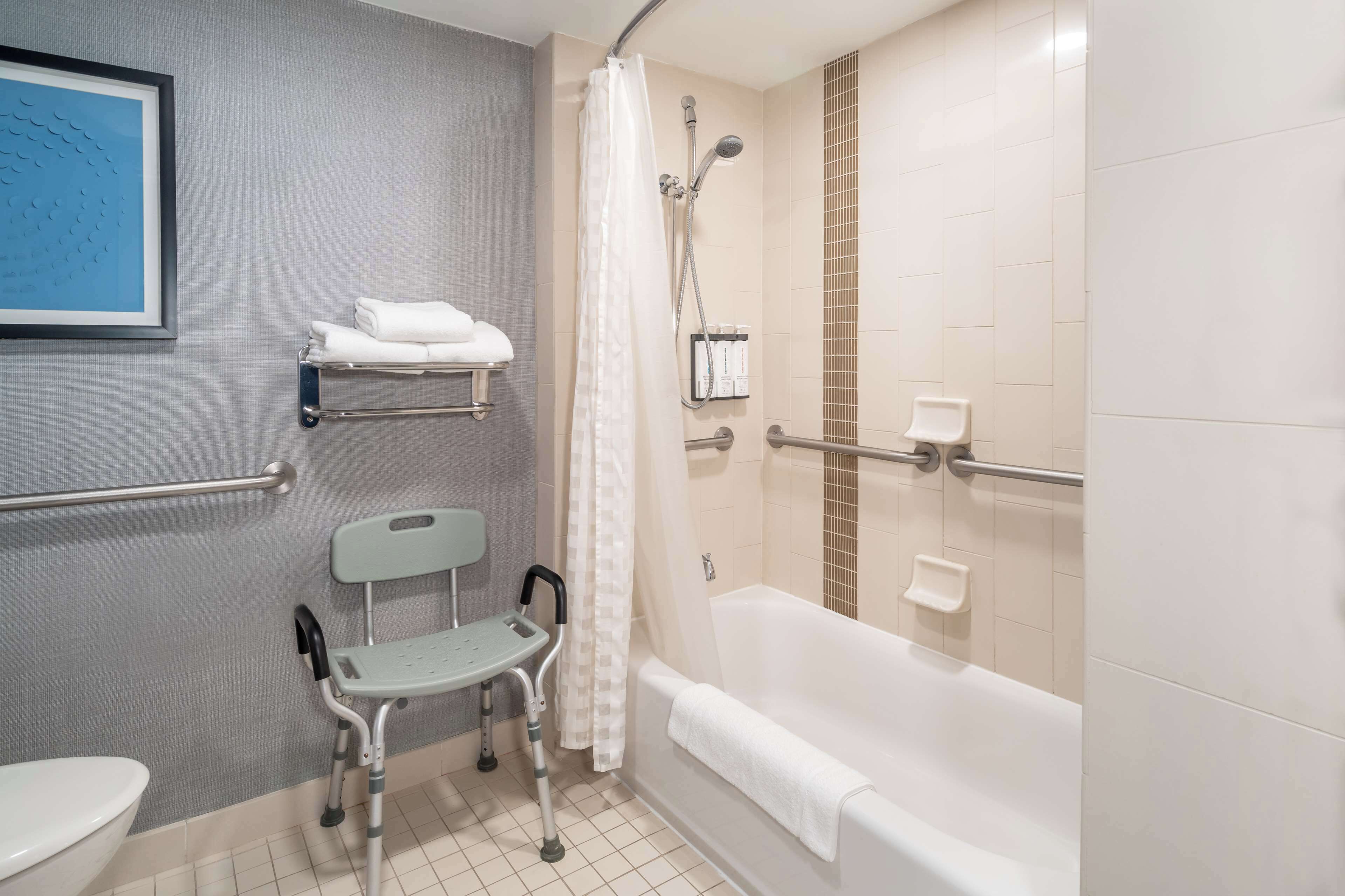 room, 1 king bed with sofa bed | bathroom | designer toiletries, hair dryer, towels, soap