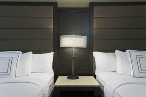 Hypo-allergenic bedding, desk, laptop workspace, blackout drapes