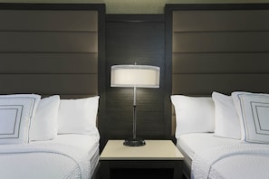 Hypo-allergenic bedding, desk, laptop workspace, blackout drapes