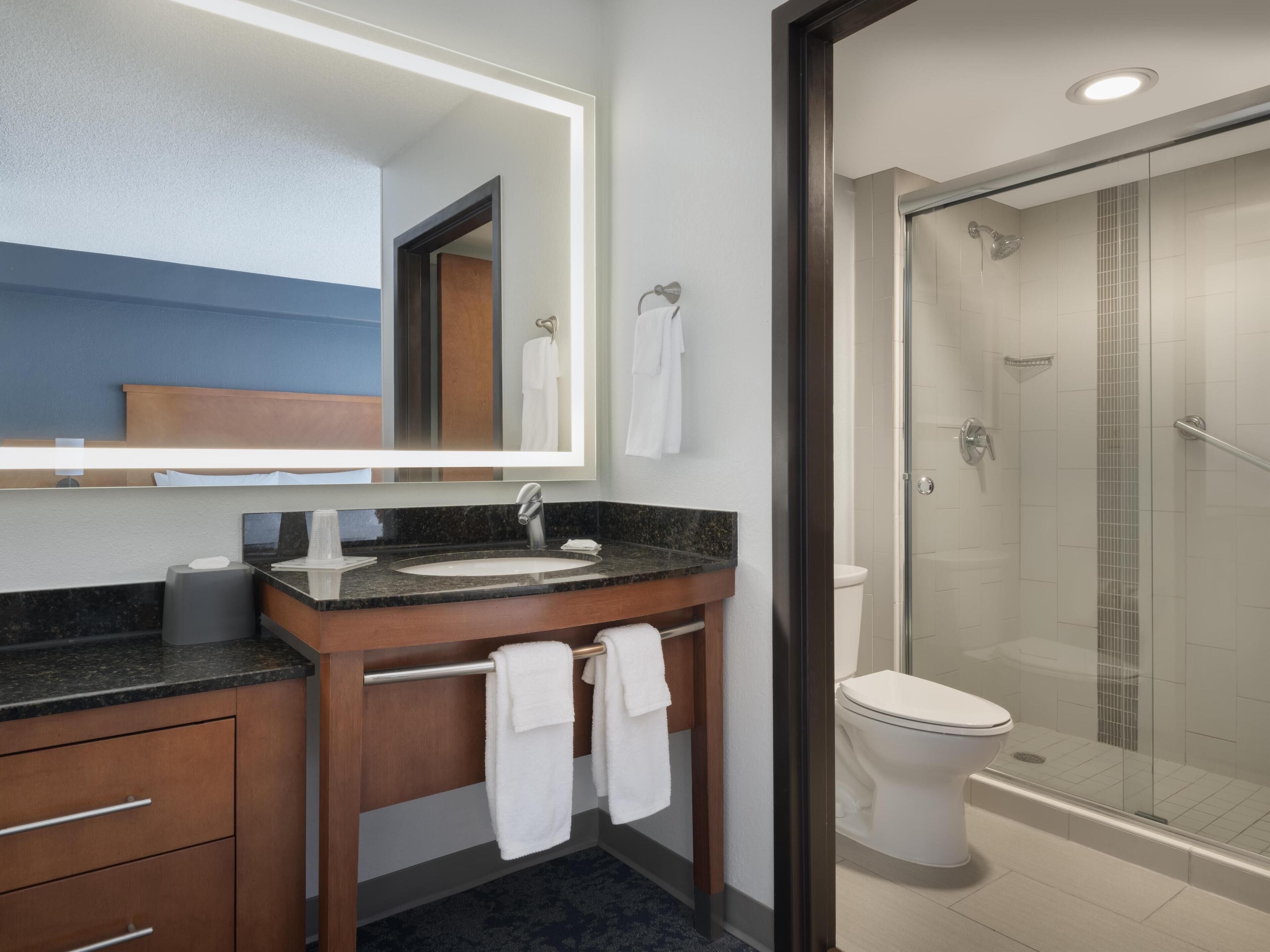 designer toiletries, hair dryer, towels, soap