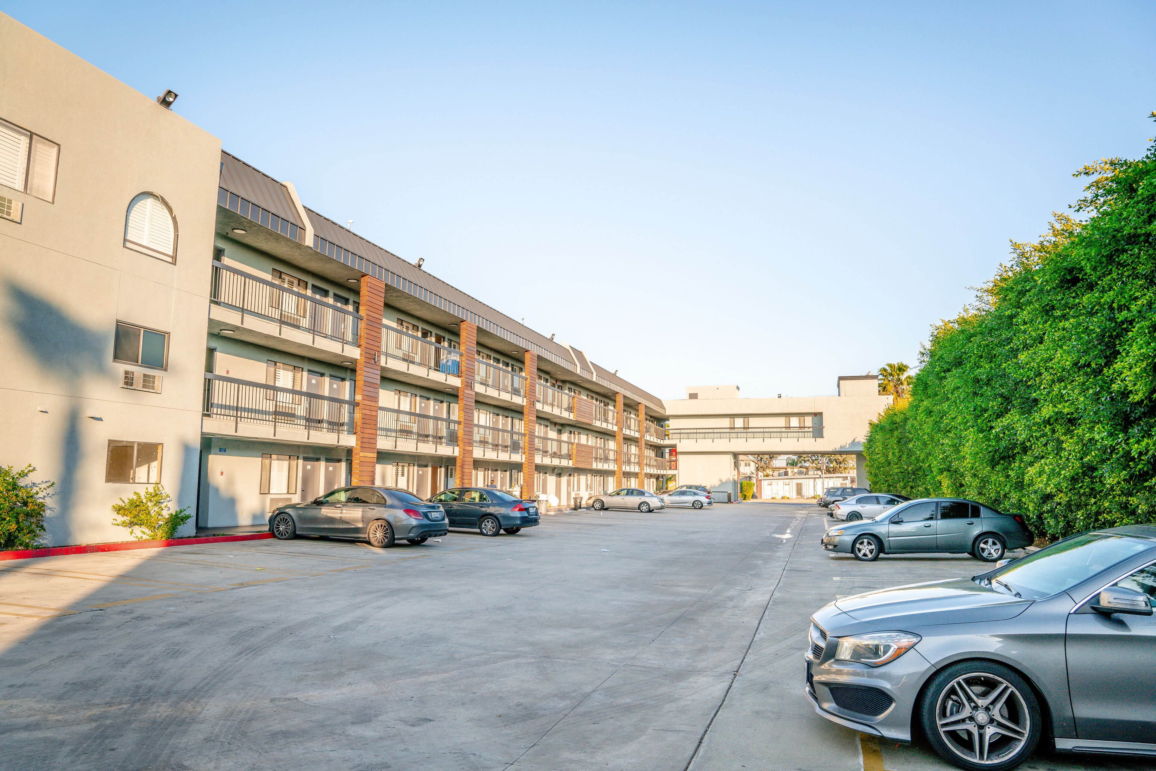 A multi-story parking garage with several cars parked.