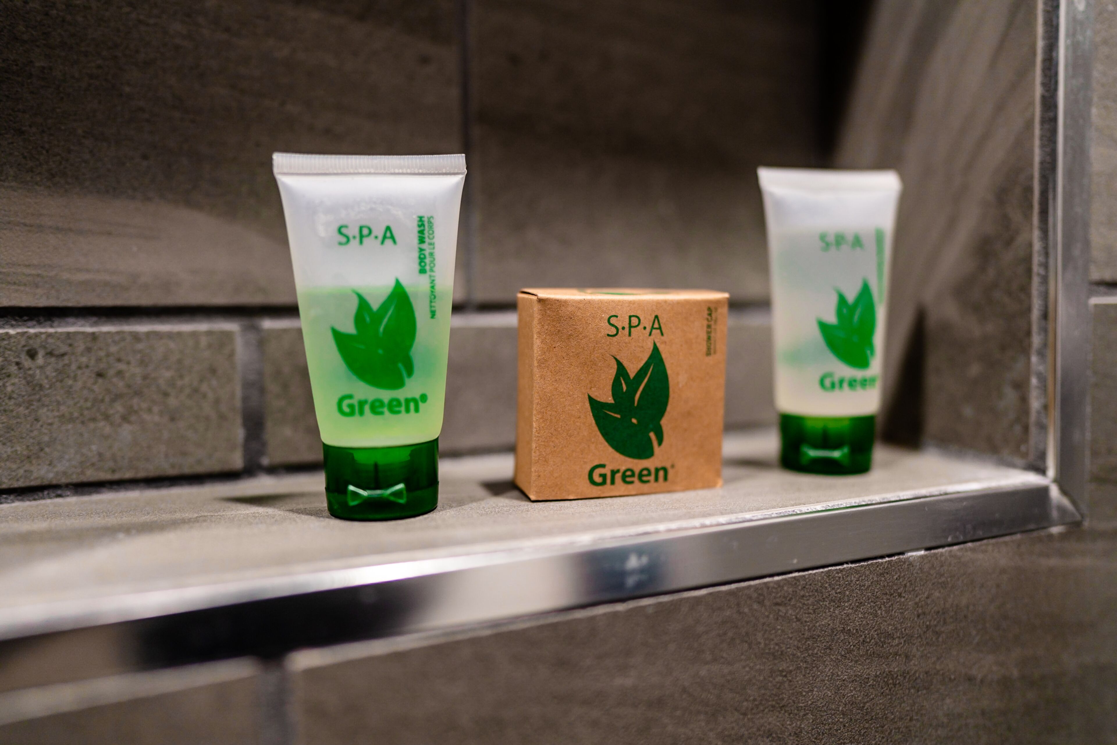 Three spa products on a shelf.