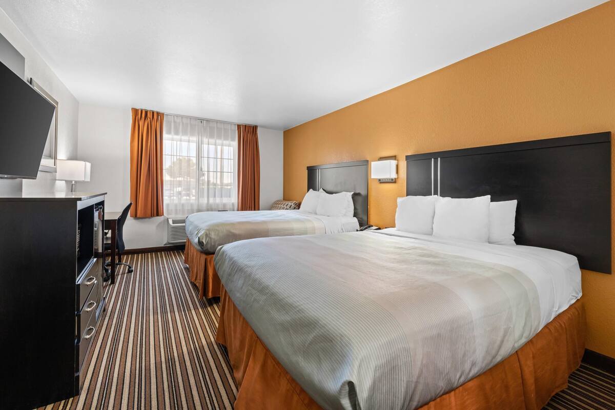 Standard Room, 2 Queen Beds, Non Smoking | Desk, iron/ironing board, WiFi (free), bed sheets