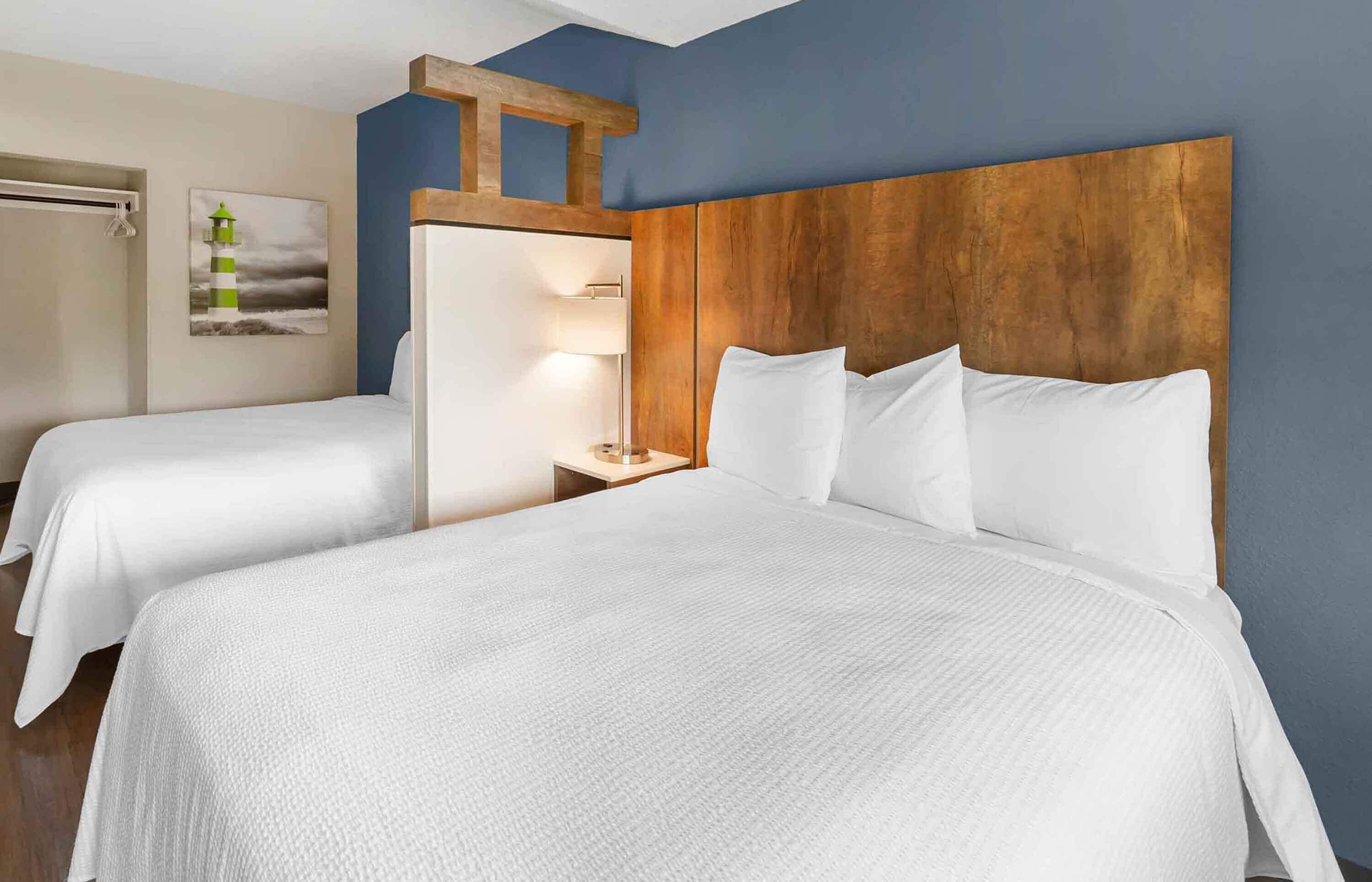 premium bedding, desk, blackout curtains, iron/ironing board