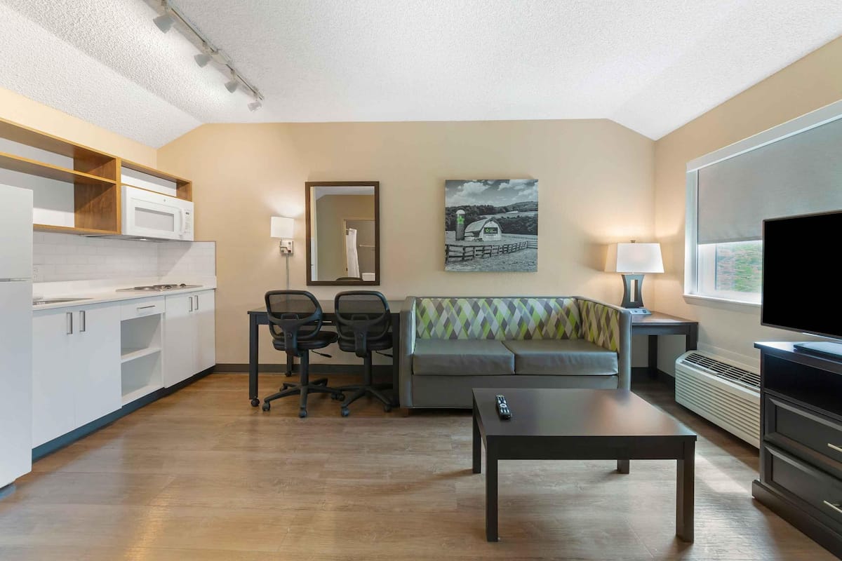 premium bedding, desk, blackout curtains, iron/ironing board