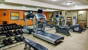 A gym with treadmills, elliptical machines, and dumbbells. - Holiday Inn Express & Suites Atlanta Buckhead by IHG (Atlanta)