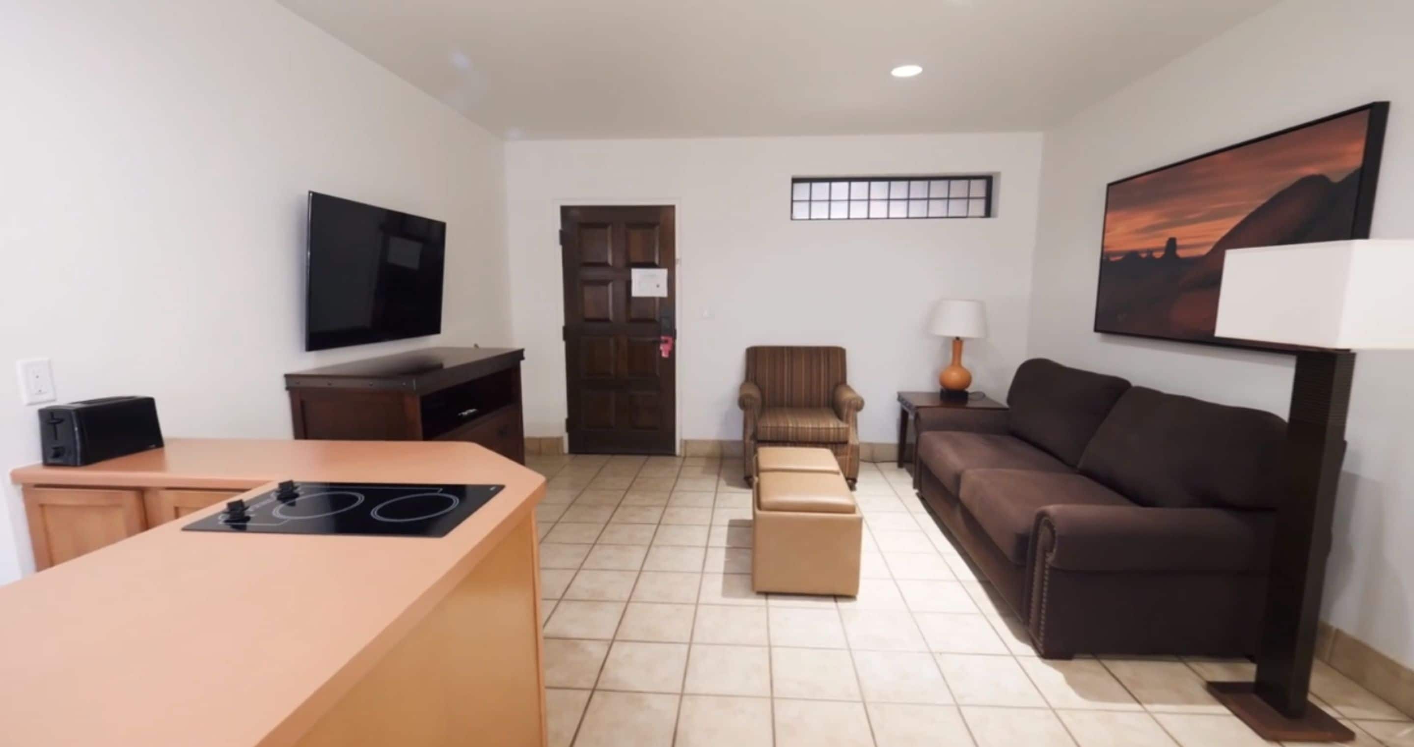 standard suite, 1 bedroom | living area | 27-inch tv with cable channels, dvd player