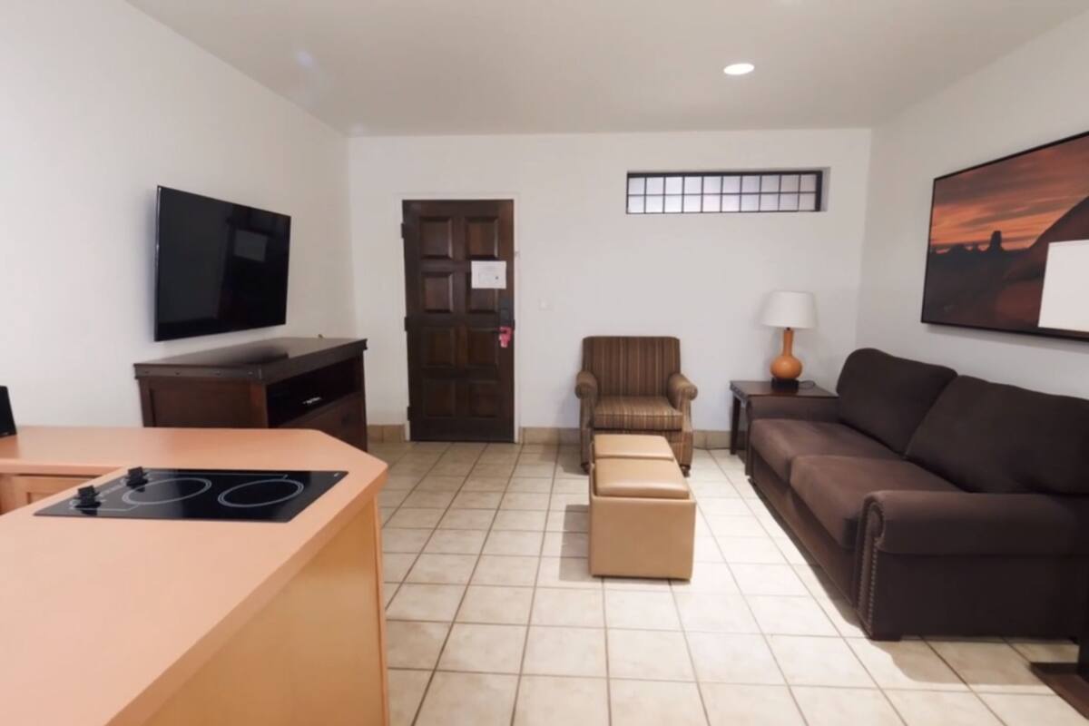 standard suite, 1 bedroom | living area | 27-inch tv with cable channels, dvd player